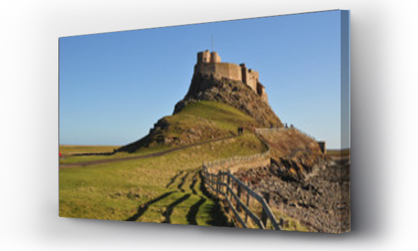 Wizualizacja Obrazu : #102875203 An iconic view of Lindisfarne (Holy island) with the castle on its distinctive  hill against a blue sky 