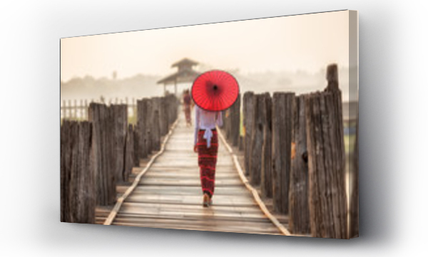 Wizualizacja Obrazu : #107903252 Burmese woman holding traditional red umbrella and walking on U Bein Bridge