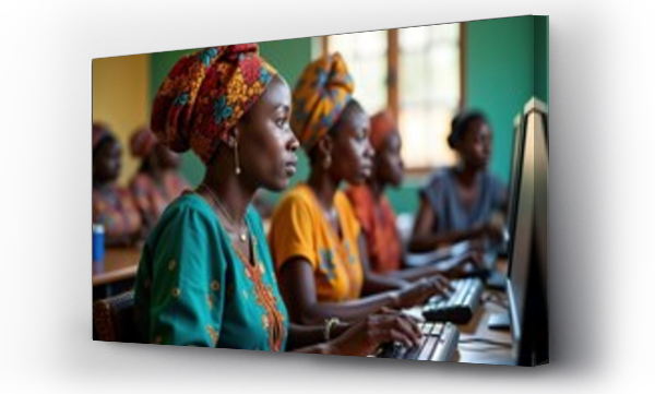 Wizualizacja Obrazu : #1226095185 African women attend computer class. Focused learners interact with pcs in classroom setting. Students study tech skills. Adult education program empowering women. Women use computers for career