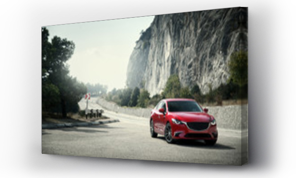 Wizualizacja Obrazu : #123522495 Red car standing on the road near mountains at daytime