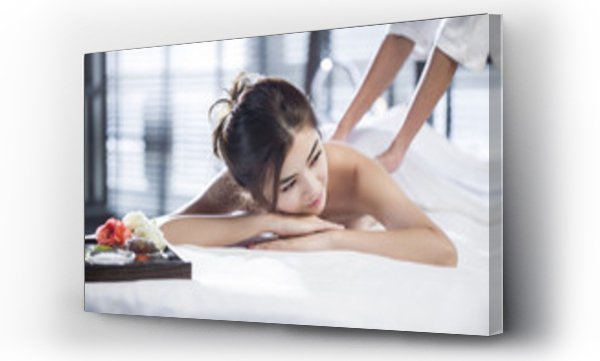 Wizualizacja Obrazu : #132115784 Masseuse giving a back massage to a woman in a spa