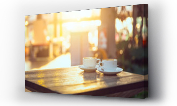 Wizualizacja Obrazu : #136397958 kawa o poranku, dwie filiżanki espresso na drewnianym stoliku w kawiarni lub coffeeshopie.