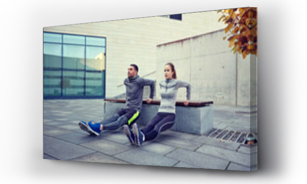 Wizualizacja Obrazu : #137387094 couple doing triceps dip exercise outdoors