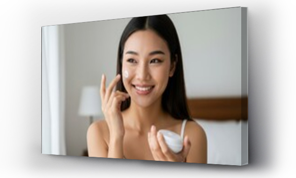 Wizualizacja Obrazu : #1409518595 Closeup beautiful young asian woman smile applying sunscreen cream lotion on skin care at bedroom, beauty asia girl makeup and cosmetic for smooth and silky, wellness and health concept