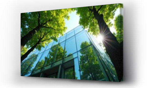 Wizualizacja Obrazu : #1527095960 Glass office building framed by tall trees, sunny day, sky reflected in windows. Eco-friendly construction, sustainable architecture in urban environment.