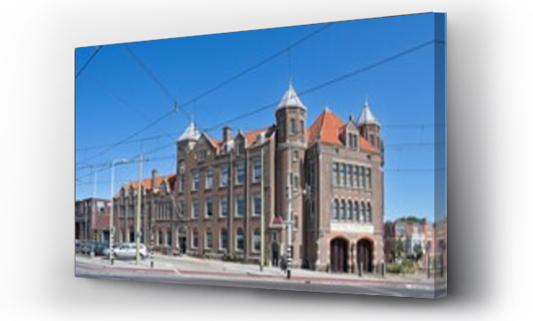Wizualizacja Obrazu : #1613695489 The former police station and fire station of Scheveningen, also called Kasteel Duinstraat, with a complex system of overhead lines for the power supply of the trams