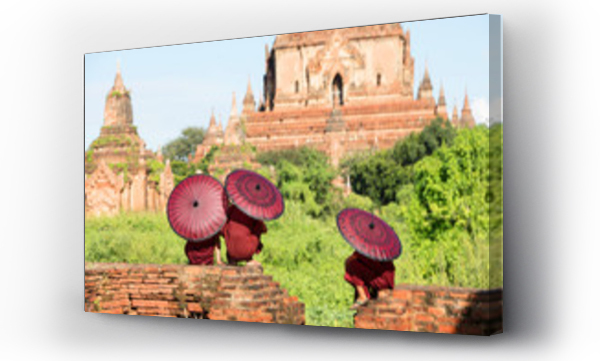 Wizualizacja Obrazu : #162309749 Monk children sitting in temple ruins under umbrellas
