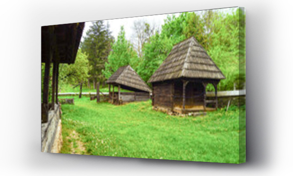 Wizualizacja Obrazu : #1634360211 Traditional Romanian wooden houses and farm buildings at Romulus Vuia Ethnographic Park, Cluj-Napoca - authentic folk village showcasing rural heritage and historical architecture in open air museum