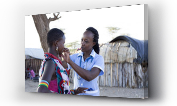 Wizualizacja Obrazu : #168855644 Nurse examing patient in rural village location. Kenya, Africa.
