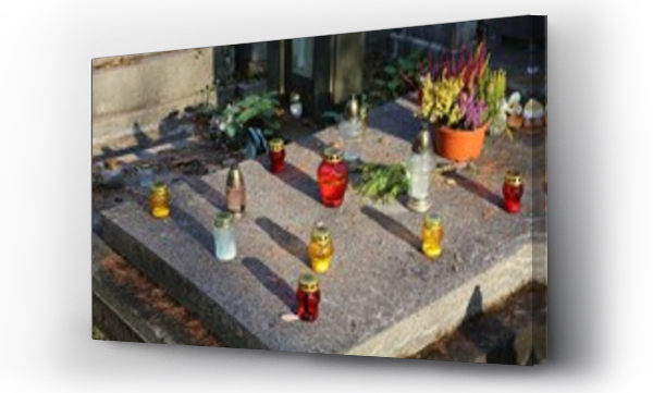 Wizualizacja Obrazu : #1745389239 Grave candles and flowers at Rakowicki Cemetery in Krakow. The historic Rakowice necropolis is a cultural heritage monument.