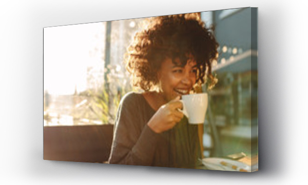 Wizualizacja Obrazu : #175958098 Woman drinking coffee at a coffee shop
