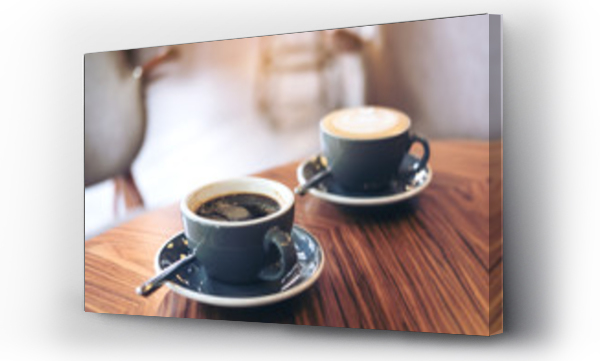 Wizualizacja Obrazu : #187470550 Closeup image of two blue cups of hot latte coffee and Americano coffee on vintage wooden table in cafe