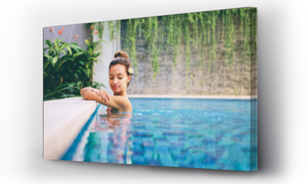 Wizualizacja Obrazu : #208820196 Swimming pool spa retreat relaxation. Relaxing woman lenjoying serenity in summer holiday travel vacation at resort hotel.