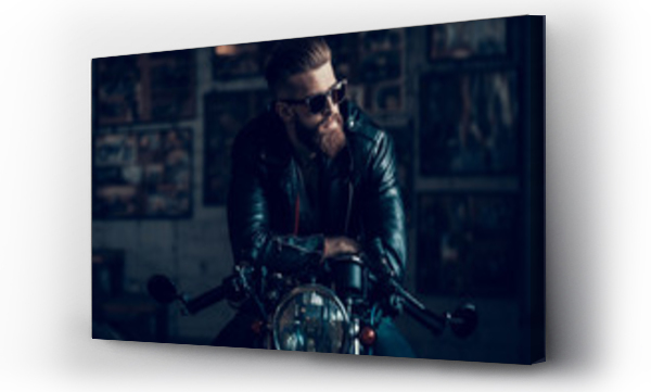 Wizualizacja Obrazu : #214611179 Young Biker in Sunglasses on Motorcycle in Garage.
