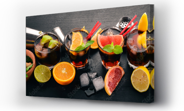Wizualizacja Obrazu : #218403964 Cocktails with citrus fruit and mint. Lemon, grapefruit, lime, orange. On a wooden background. Top view.