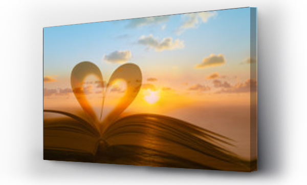 Wizualizacja Obrazu : #220614991 Book heart against beautiful sunset.Reading, love, romance and religion concept. Double exposure.