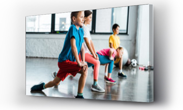 Wizualizacja Obrazu : #248649141 Kids warming up before training in gym