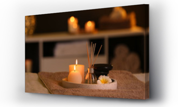 Wizualizacja Obrazu : #263932125 Burning candles and aromatic reed freshener on table in spa salon