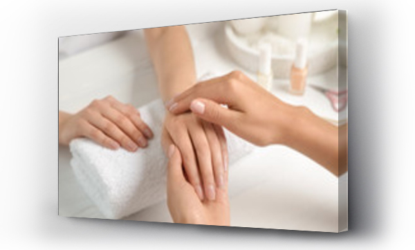 Wizualizacja Obrazu : #271339844 Cosmetologist massaging clients hand at table in spa salon, closeup