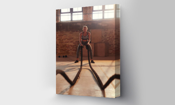 Wizualizacja Obrazu : #286121554 Fitness workout. Sport woman doing battle rope exercise at gym
