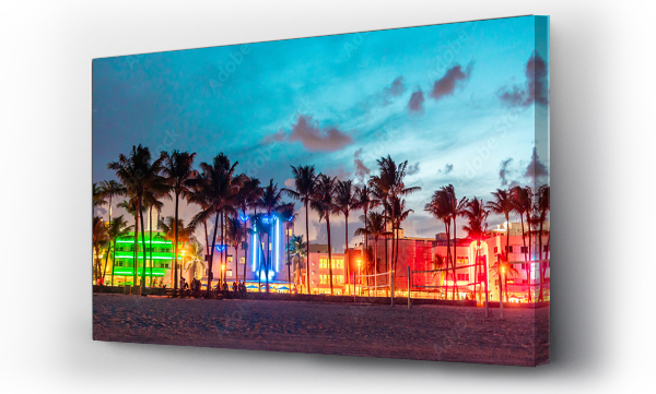 Wizualizacja Obrazu : #291616174 Miami Beach Ocean Drive panorama with hotels and restaurants at sunset. City skyline with palm trees at night. Art deco nightlife on South beach