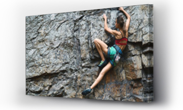 Sports Woman With slim fit body Climbing The Rock Having Workout in Mountains. rock climbing hard moves
