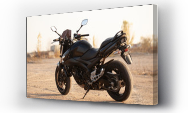 Wizualizacja Obrazu : #300170337 One black motorcycle in the desert.