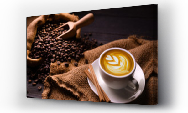 Wizualizacja Obrazu : #306809770 Cup of coffee latte and coffee beans in burlap sack on old wooden background