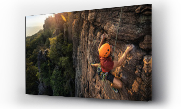 Wizualizacja Obrazu : #315712950 Man climbing Battert rock during sunset