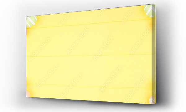 Wizualizacja Obrazu : #321877626 Easter banner with pastel colored egg double side border over a yellow wood background. Overhead view with copy space.