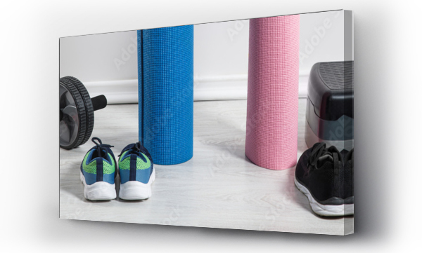 Wizualizacja Obrazu : #325749227 panoramic shot of yoga mats, sneakers, step platform and sport equipment on floor at home