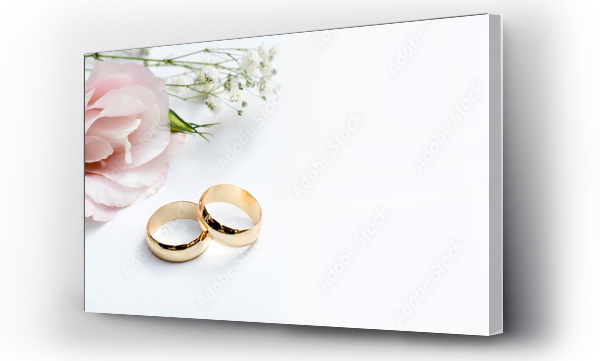 Wizualizacja Obrazu : #327010124 Różowe kwiaty i dwie złote obrączki ślubne na białym tle.