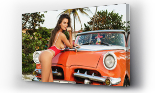 Wizualizacja Obrazu : #330726259 Sexy woman wearing red swimsuit posing beside a retro cabriolet car on the beach