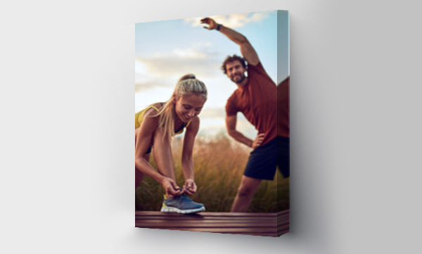 Wizualizacja Obrazu : #360124720 Young adult sporty couple working out outdoors.