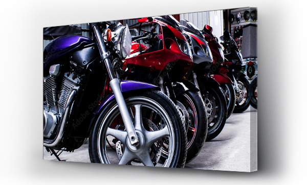 Wizualizacja Obrazu : #361080070 Colored sports, road beautiful bikes in a motor show, close up. Many motorcycles parked in a store. Sale of used cruise motorbikes in the cabin. Showroom equipment in the garage. Banner for web site