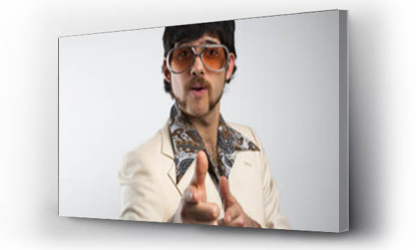 Wizualizacja Obrazu : #363415695 Portrait of a retro man in a 1970s leisure suit and sunglasses pointing to the camera