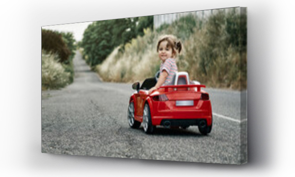 Wizualizacja Obrazu : #376984737 A girl riding a toy car