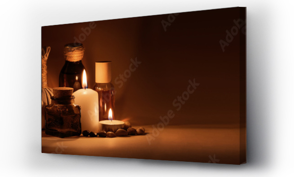Wizualizacja Obrazu : #383383794 Beautiful spa composition with candles, frangipani flower, oil flasks, bowl with salt and herbal ball. Nice warm dark background. Tropical highlights from window. Copy space.