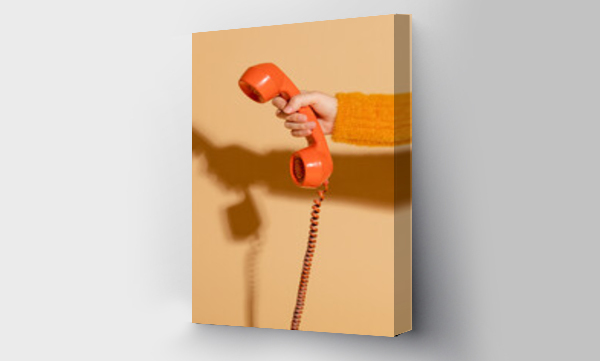 Wizualizacja Obrazu : #391953432 Woman answering a corded retro phone