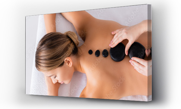 Wizualizacja Obrazu : #410383615 Top view of young woman getting hot stone massage in spa salon, banner