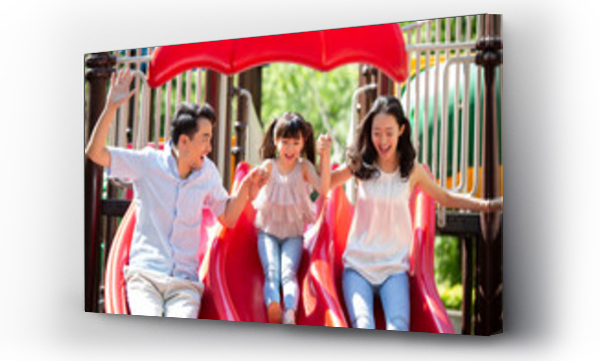 Wizualizacja Obrazu : #427186799 Happy young family playing in amusement park