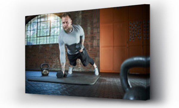 Wizualizacja Obrazu : #431967071 Active sportsman exercising with dumbbell in gym