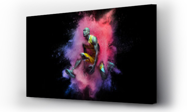 Wizualizacja Obrazu : #437029345 One young sportsman basketball player in explosion of colored neon powder isolated on black background
