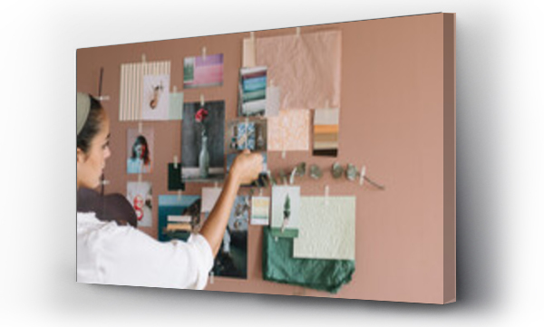 Wizualizacja Obrazu : #439368724 Young Woman Hanging Pictures on the Wall for a Moodboard