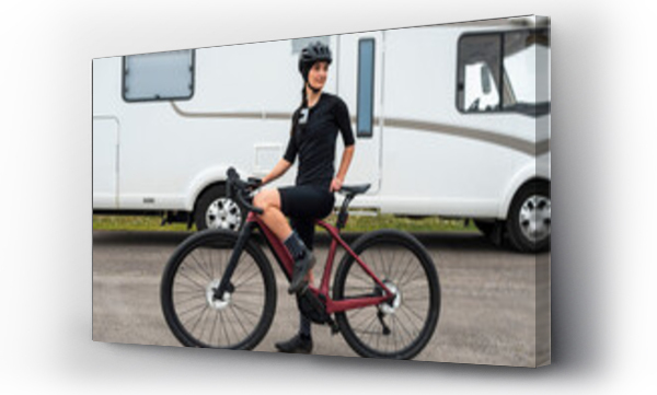 Wizualizacja Obrazu : #439732395 Sporty woman with electric bike near camper van 