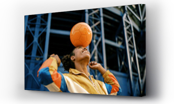 Wizualizacja Obrazu : #439899157 Female footballer with ball in city