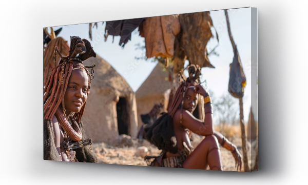 Wizualizacja Obrazu : #451626508 Panoramic shot showing Himba tribeswomen sitting outside their huts in a traditional Himba village near Kamanjab in northern Namibia, Africa.