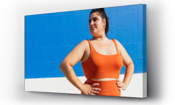 Wizualizacja Obrazu : #453115135 Plus size ethnic sportswoman with hands on waist