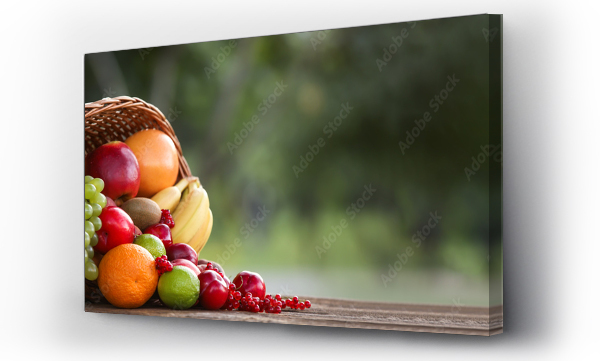 Wizualizacja Obrazu : #457927038 Wicker basket with fresh fruits on table with space for text