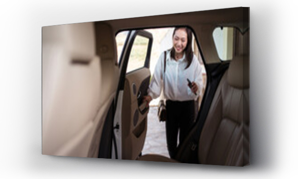 Wizualizacja Obrazu : #461279135 Crop positive ethnic female passenger in formal wear with smartphone opening the back door of the car